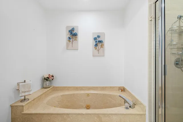 a view of walk in closet with clothes