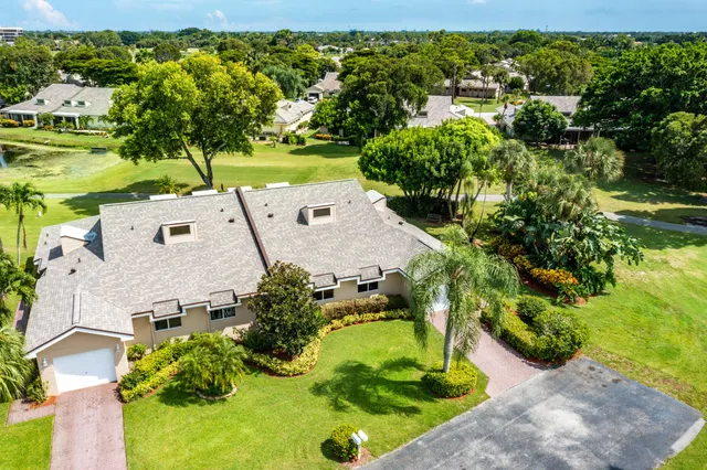 an aerial view of a house with a garden