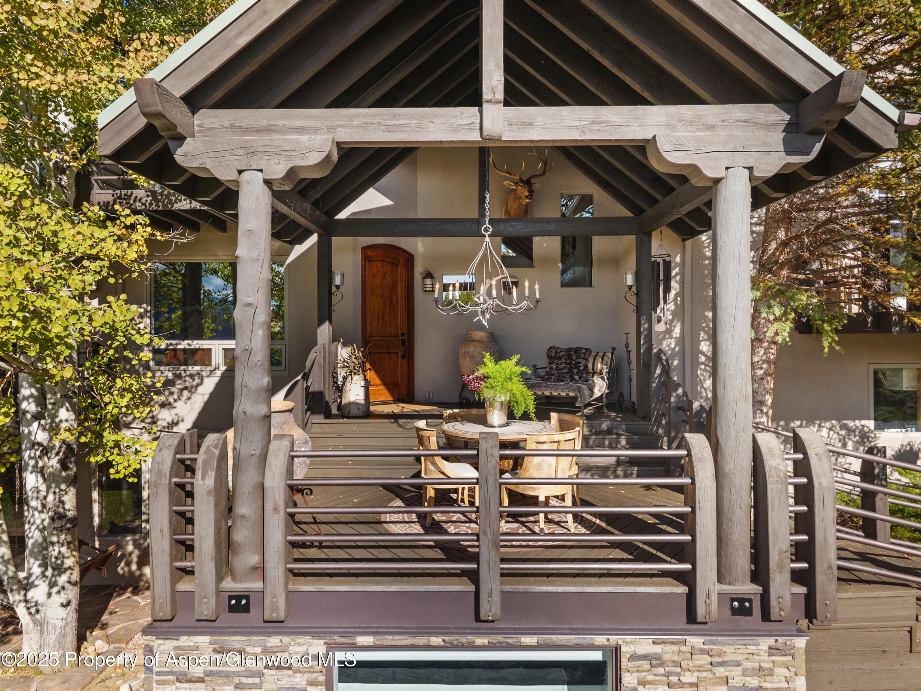 a view of a chairs and table in a patio