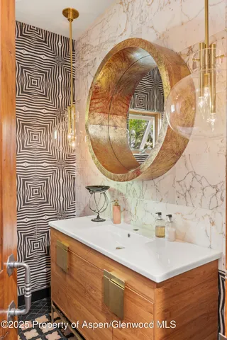 a bathroom with a sink and a mirror