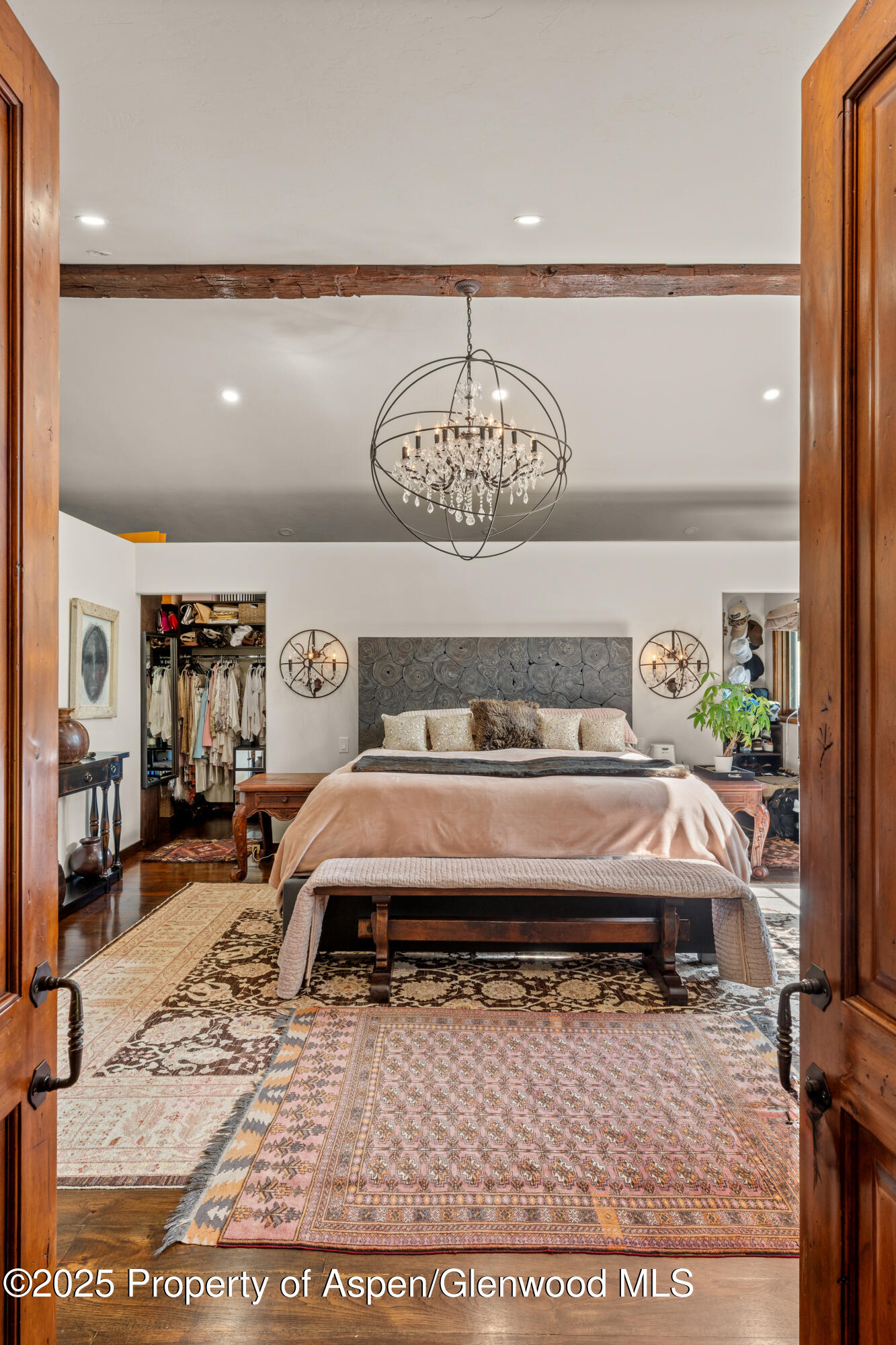 189 Light Hill Road Snowmass, CO 81654 - Photo 16 of 44 a bedroom with a bed and a table