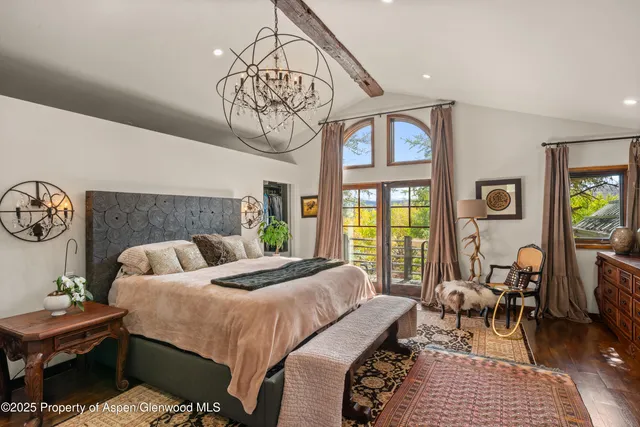 a bedroom with a bed and a table in it