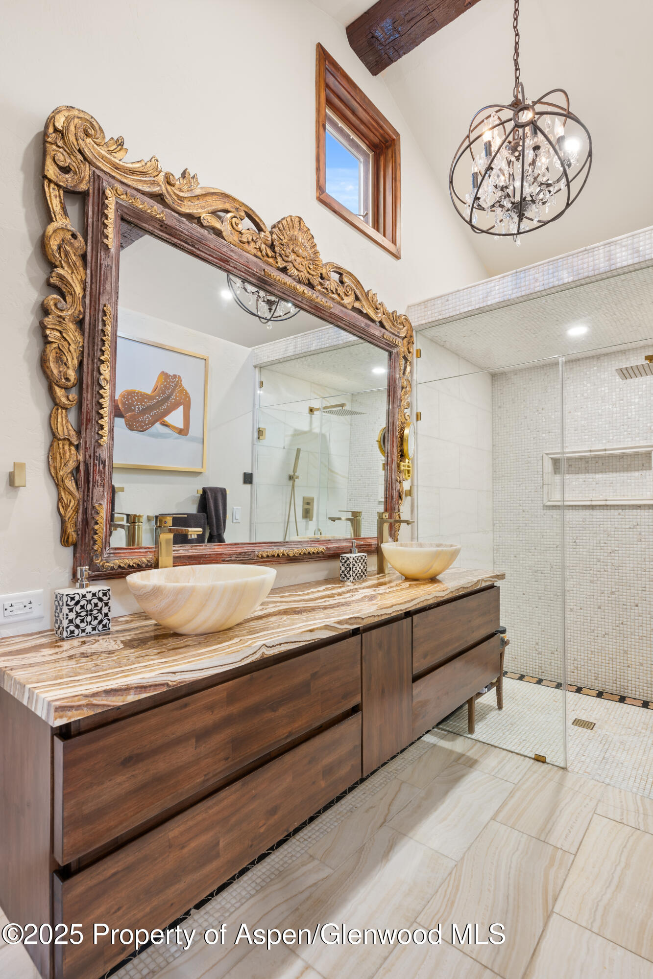 189 Light Hill Road Snowmass, CO 81654 - Photo 20 of 44 a bathroom with a sink a large mirror and a shower
