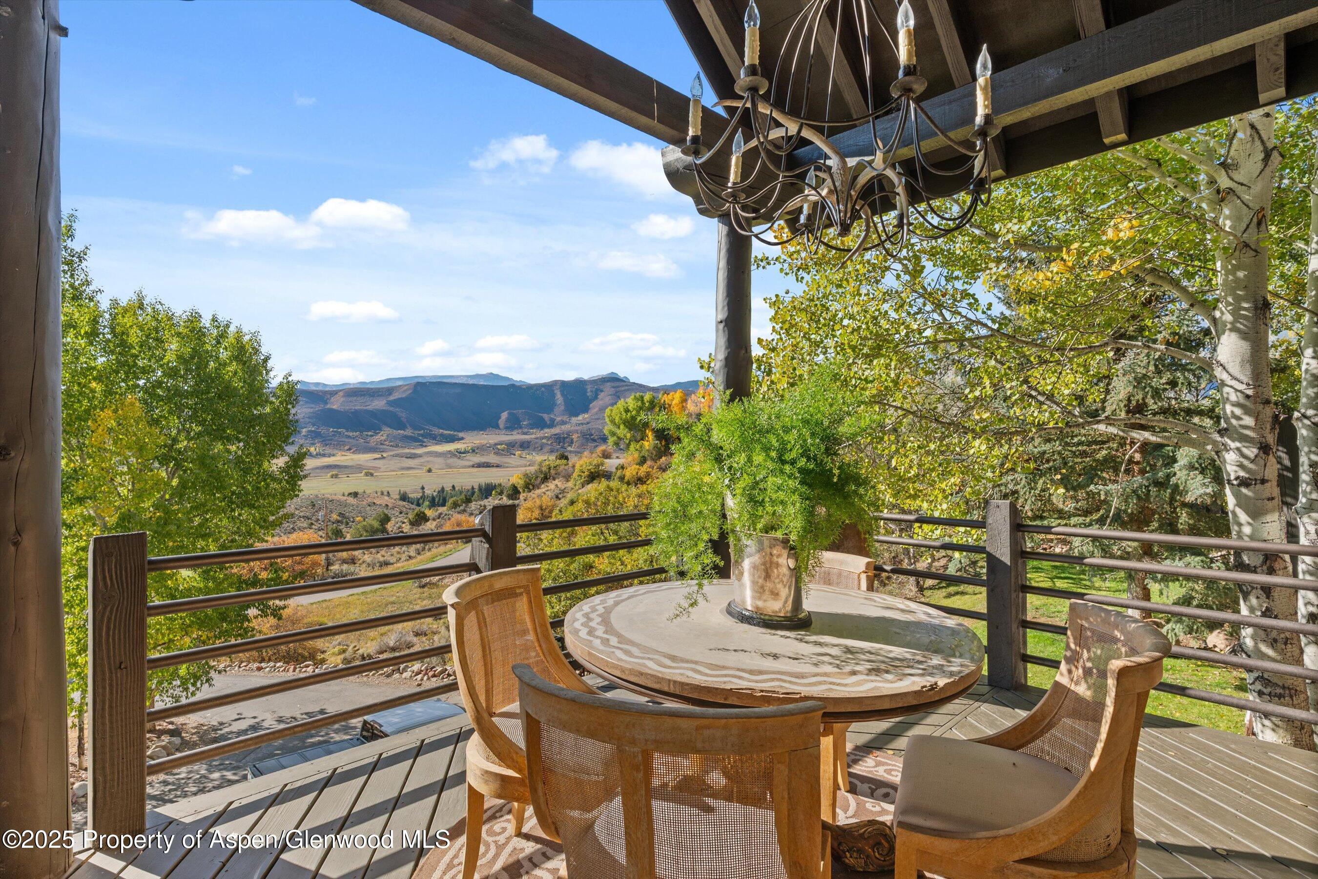 189 Light Hill Road Snowmass, CO 81654 - Photo 32 of 44 a view of a chairs and table in the patio