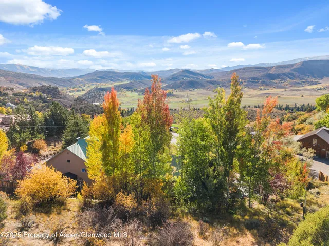 a view of an ocean and a mountain