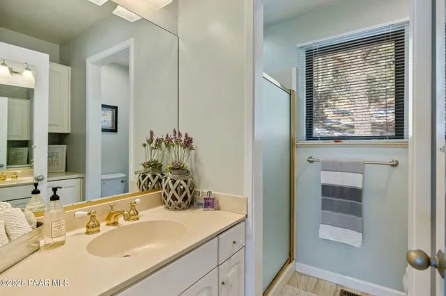 a dining room with furniture and a floor to ceiling window