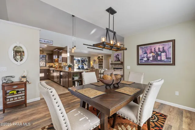 a kitchen with lots of counter top space sink and wooden floor