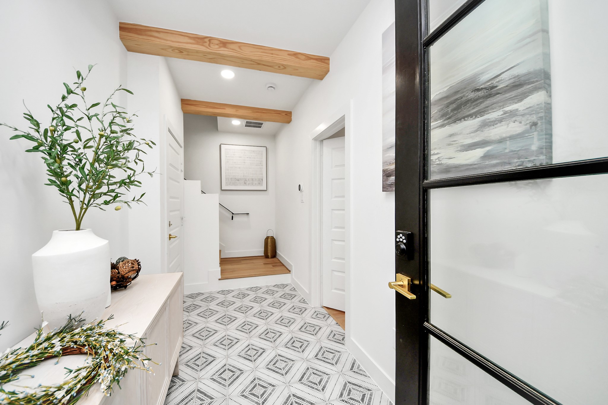 2211 Bevis Street Houston, TX 77008 - Photo 5 of 34 Gorgeous entry. First floor bedroom/Study/Office and full bath off the entry on the right.