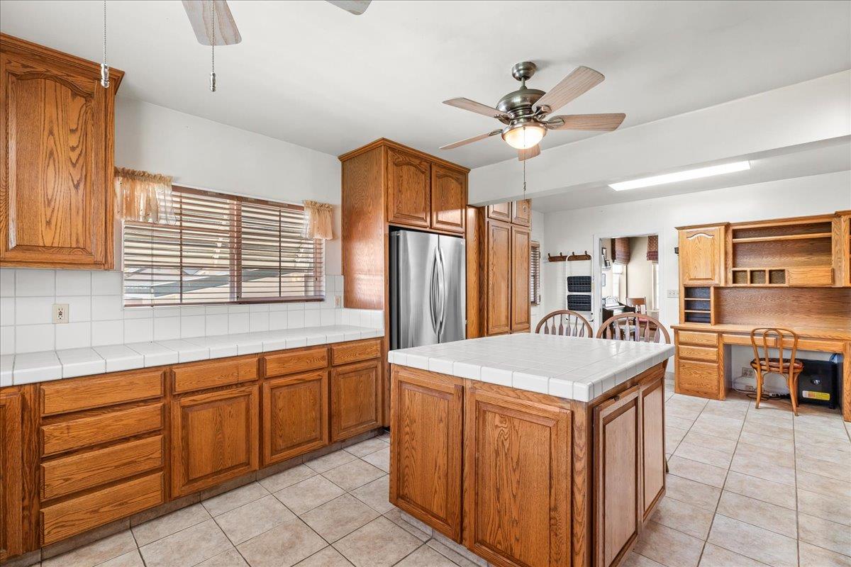 4701 Lone Tree Road Valley Home, CA 95361 - Photo 25 of 59 a kitchen with stainless steel appliances a sink and a refrigerator