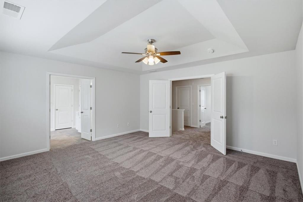 585 Summit Point Canton, GA 30114 - Photo 13 of 30 a view of an empty room with a ceiling fan