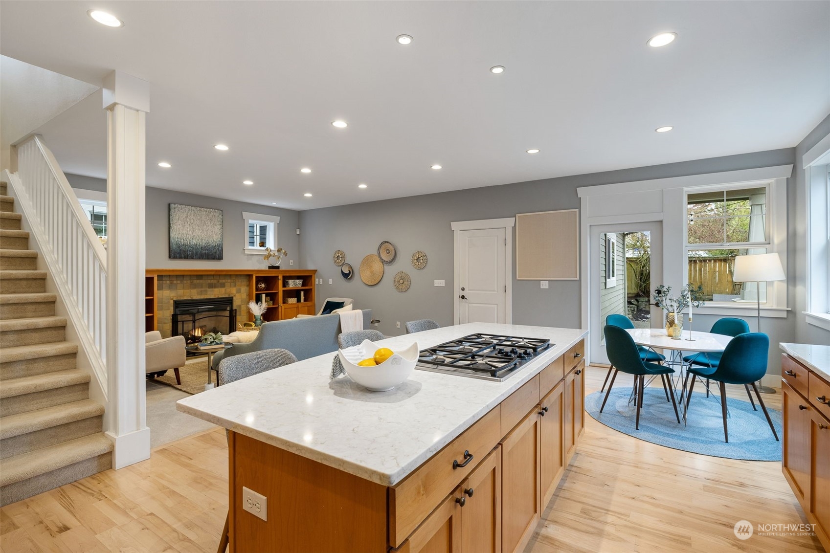 740 North 78th Street Seattle, WA 98103 - Photo 19 of 40 a kitchen with a table chairs and wooden floor