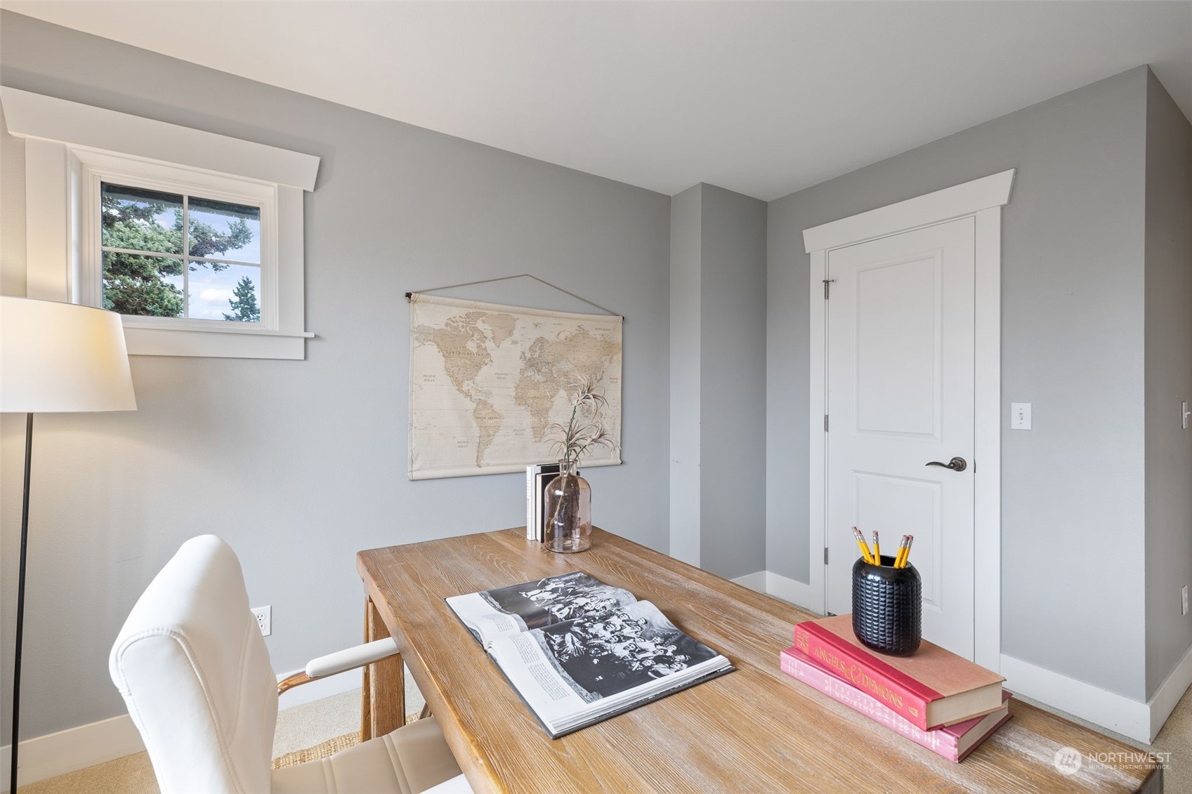 740 North 78th Street Seattle, WA 98103 - Photo 26 of 40 a bed room with a bed and a lamp