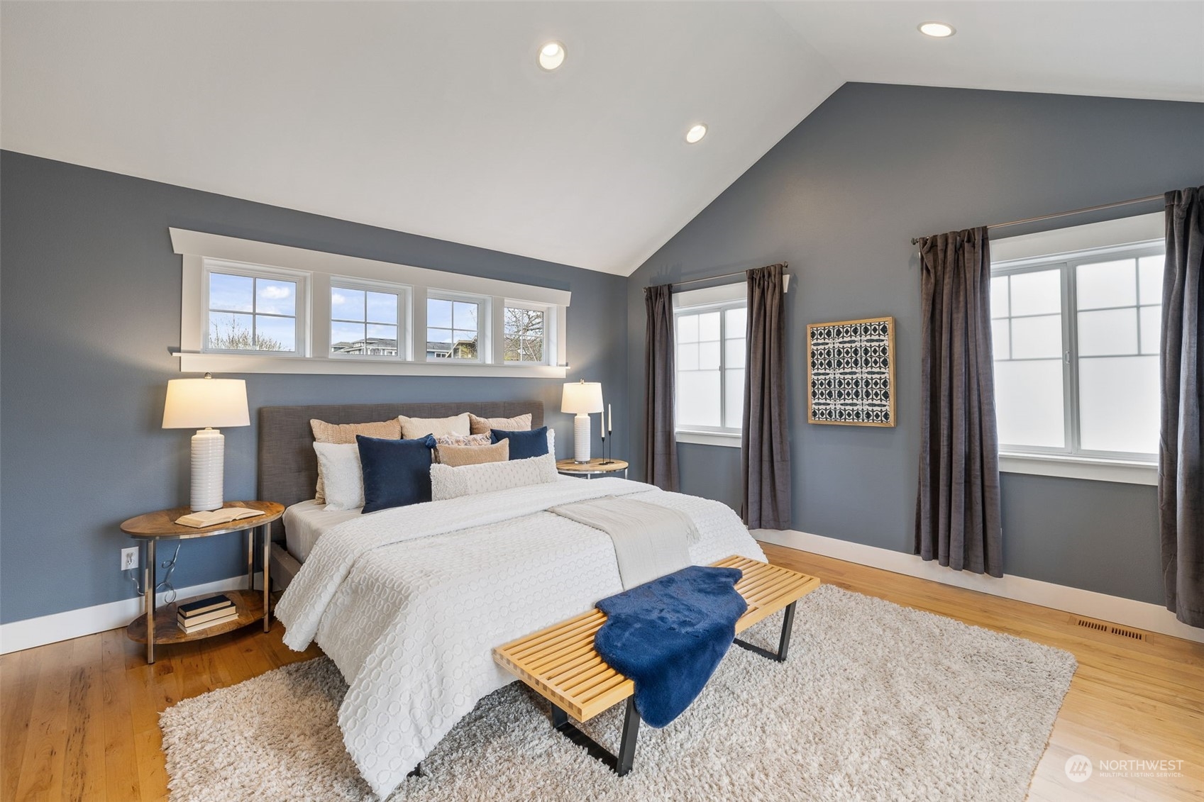 740 North 78th Street Seattle, WA 98103 - Photo 34 of 40 a bedroom with a bed a dresser and next to a window