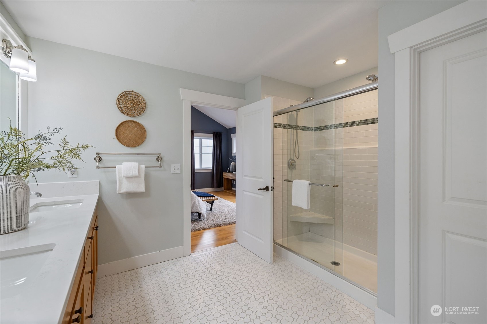 740 North 78th Street Seattle, WA 98103 - Photo 36 of 40 a bathroom with a sink a mirror and a shower