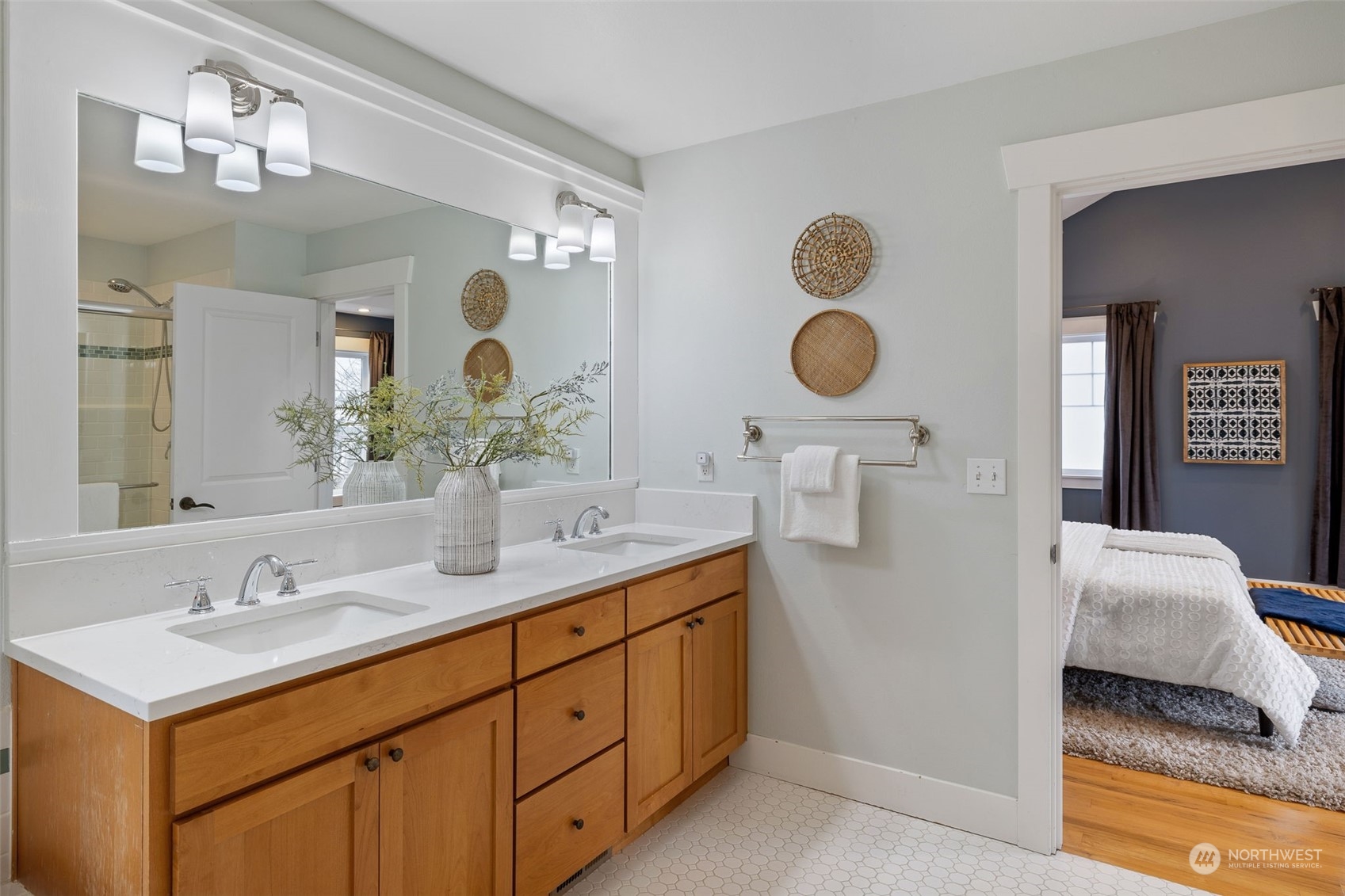 740 North 78th Street Seattle, WA 98103 - Photo 37 of 40 a bathroom with a double vanity sink and a mirror