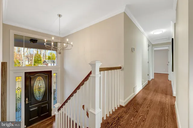 a living room with furniture a table and a potted plant