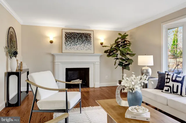 a large kitchen with kitchen island a stove a sink a refrigerator and wooden floor