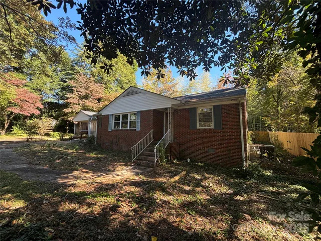 a house with trees in the background