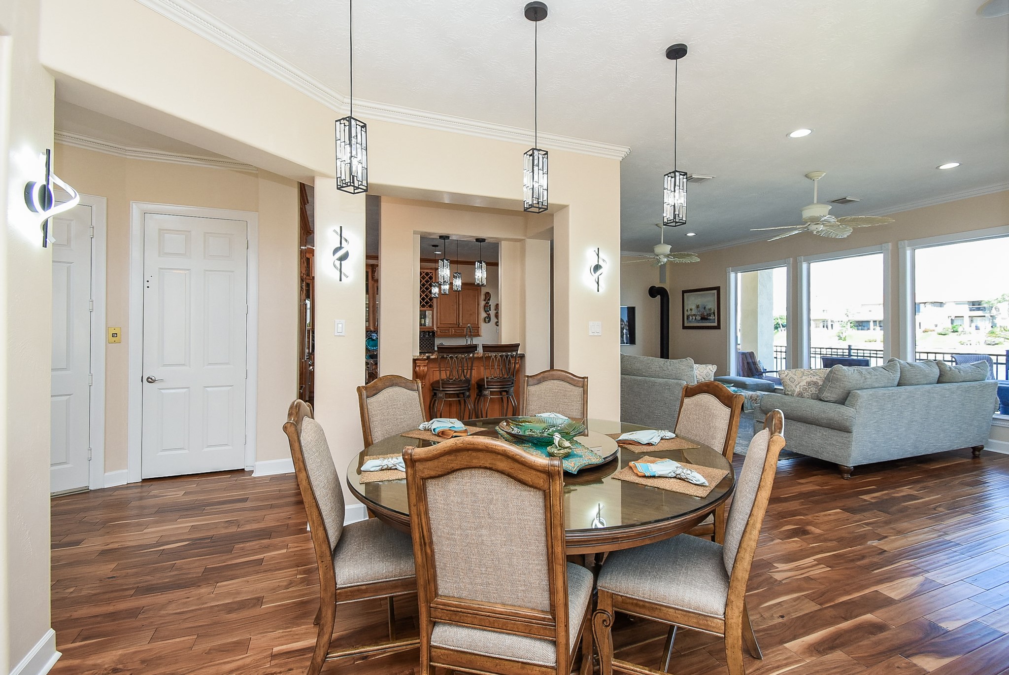 313 Harborside Circle Kemah, TX 77565 - Photo 16 of 35 a view of a dining room and livingroom with furniture wooden floor a chandelier
