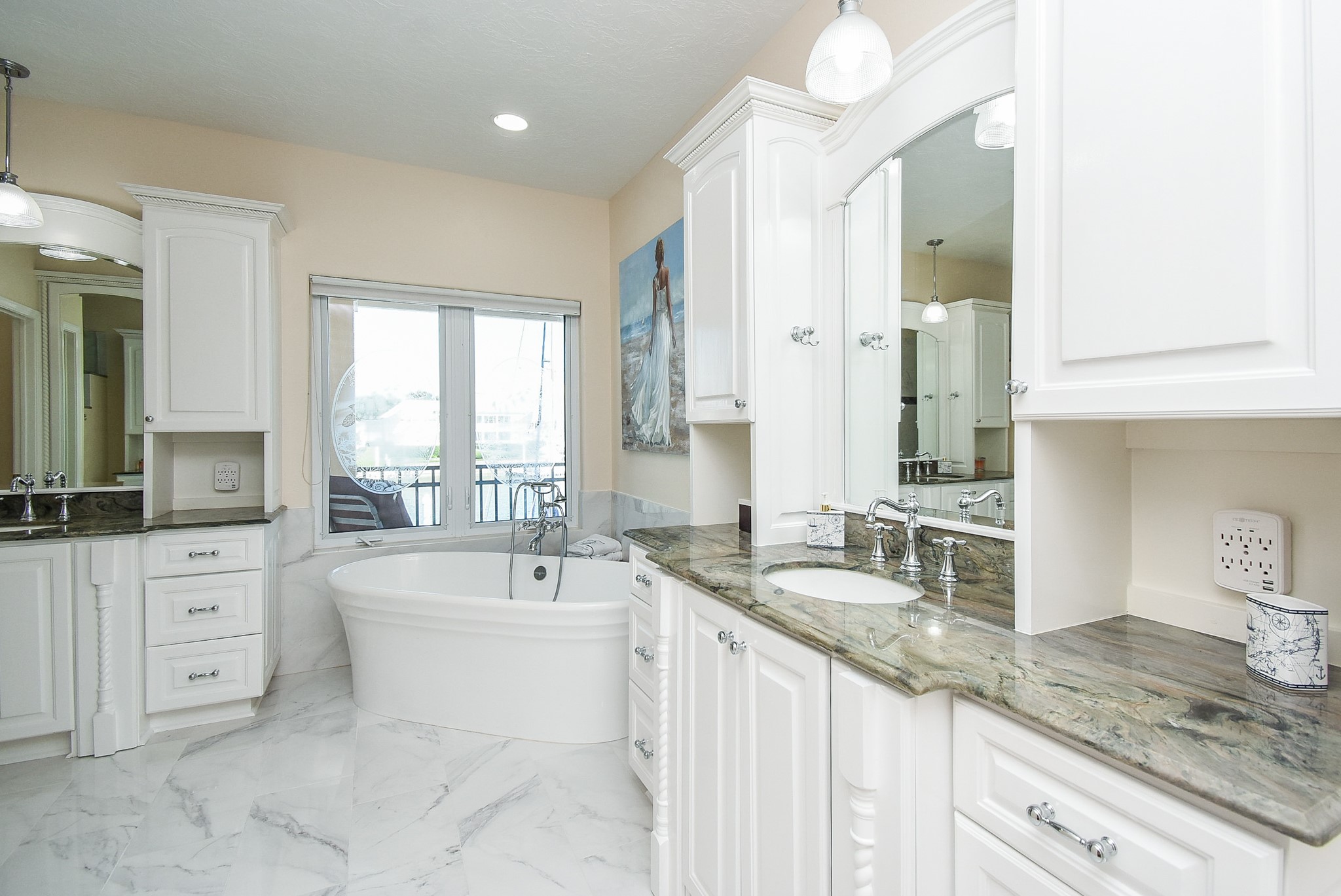 313 Harborside Circle Kemah, TX 77565 - Photo 21 of 35 a bathroom with a granite countertop double vanity sink a mirror and a bathtub