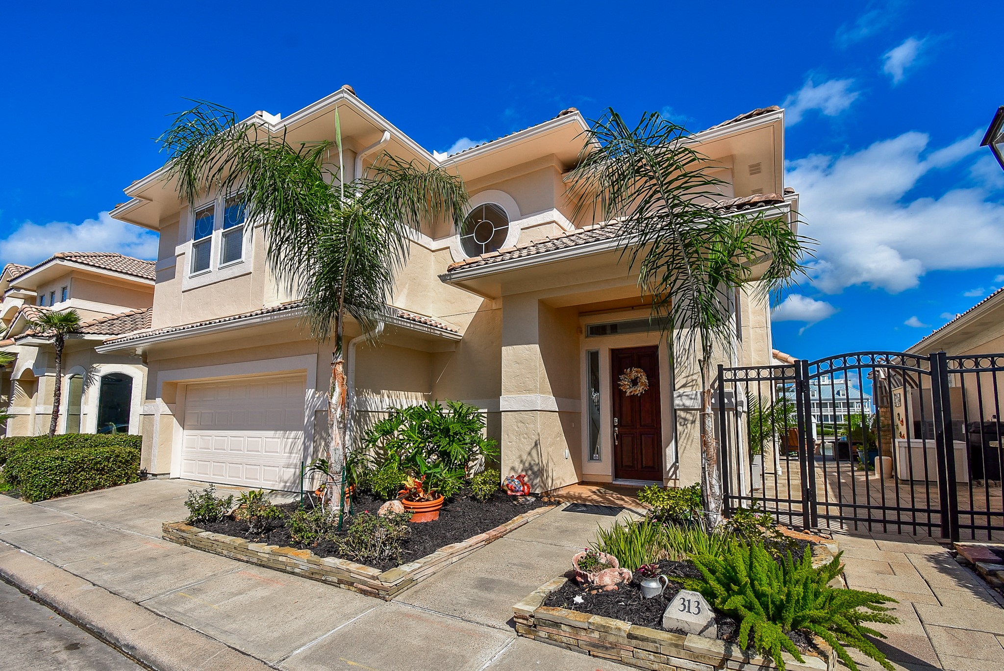 313 Harborside Circle Kemah, TX 77565 - Photo 3 of 35 a view of a house with potted plants