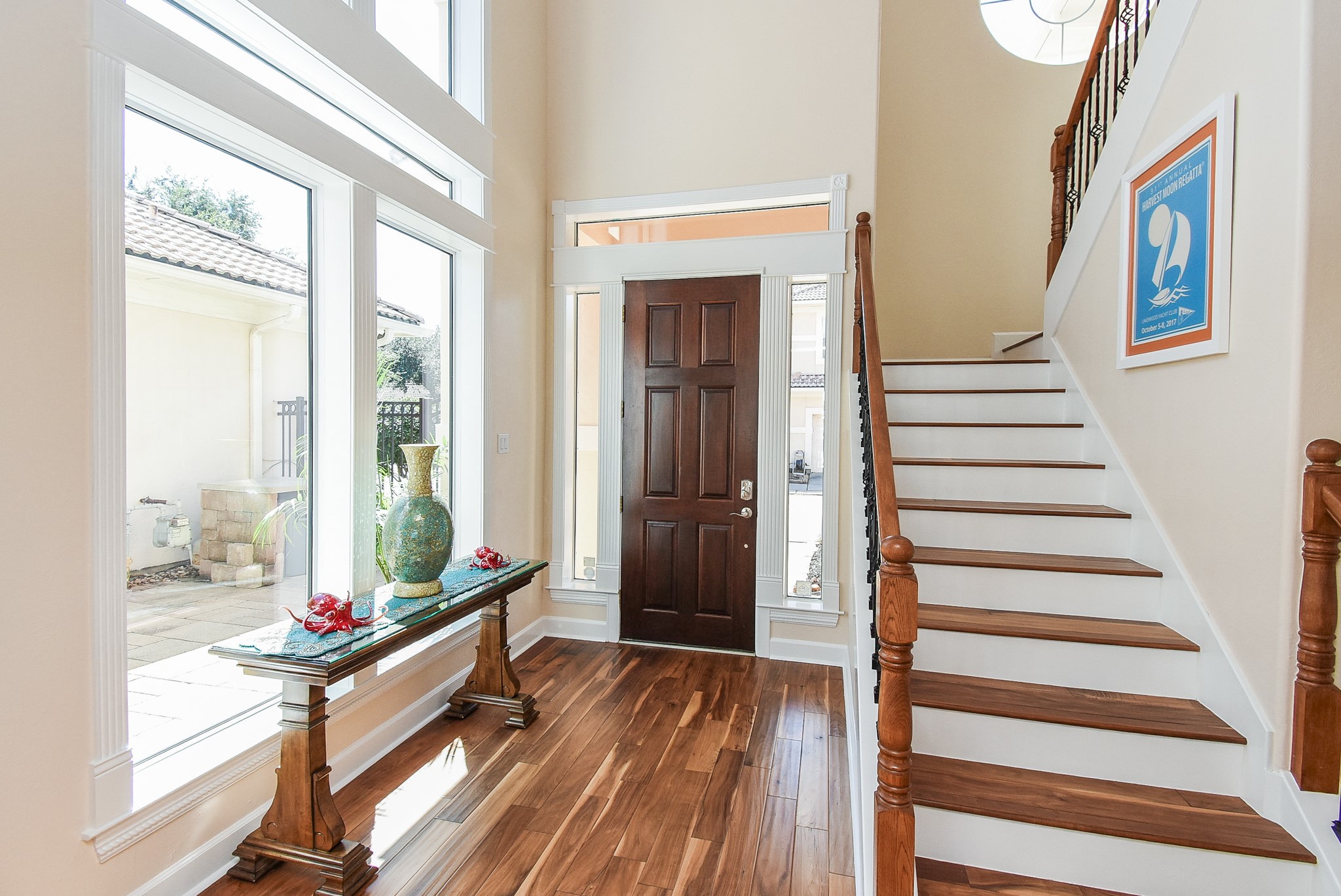 313 Harborside Circle Kemah, TX 77565 - Photo 5 of 35 a living room with wooden floor and large windows
