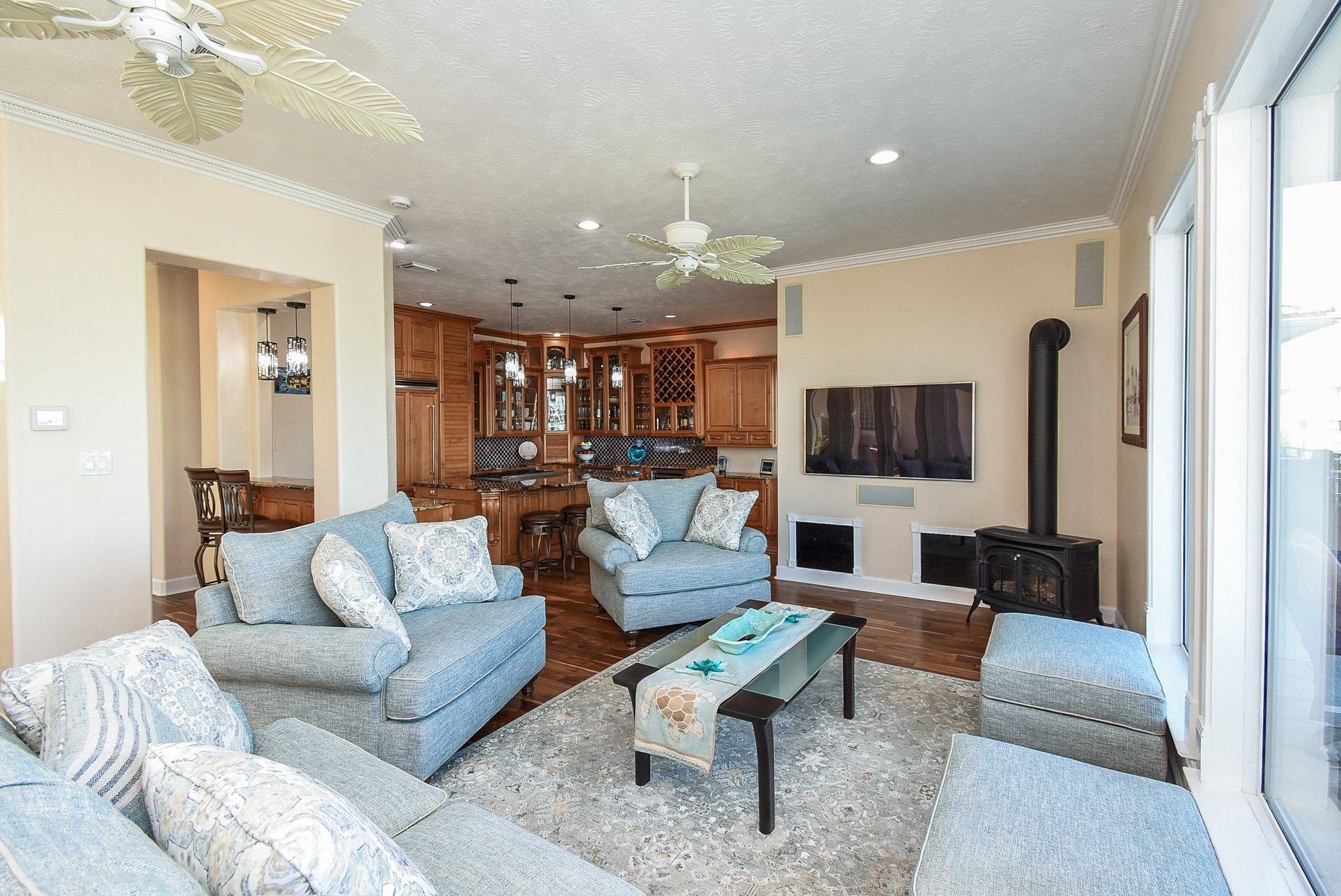 313 Harborside Circle Kemah, TX 77565 - Photo 6 of 35 a living room with furniture a flat screen tv and a large window