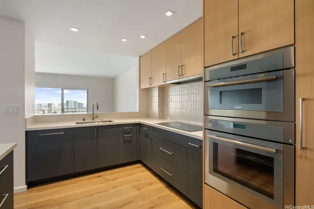 a kitchen with a sink and cabinets