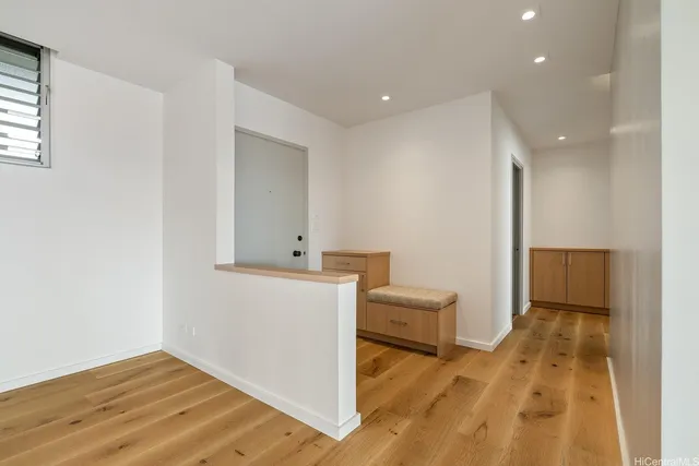 a view of a hallway with bathroom