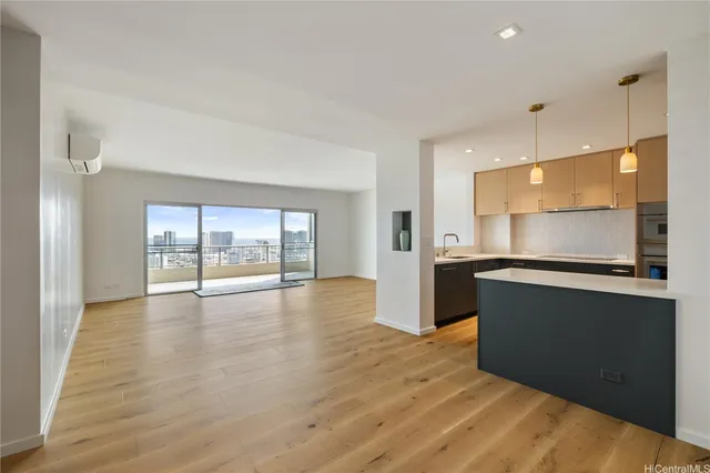 a view of kitchen with wooden floor and window