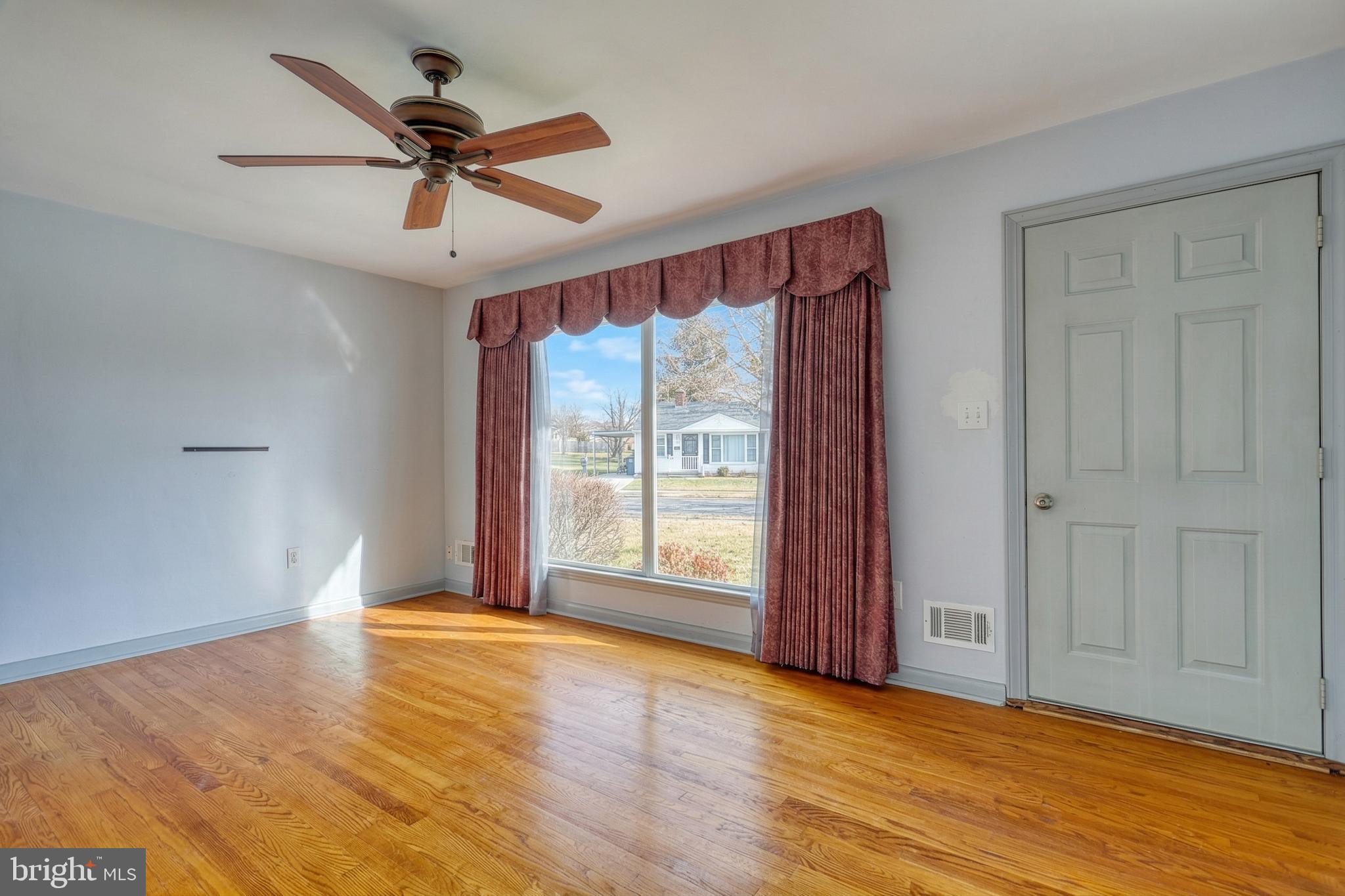 30 Lincoln Drive Hanover, PA 17331 - Photo 12 of 74 a view of a livingroom with a ceiling fan and wooden floor