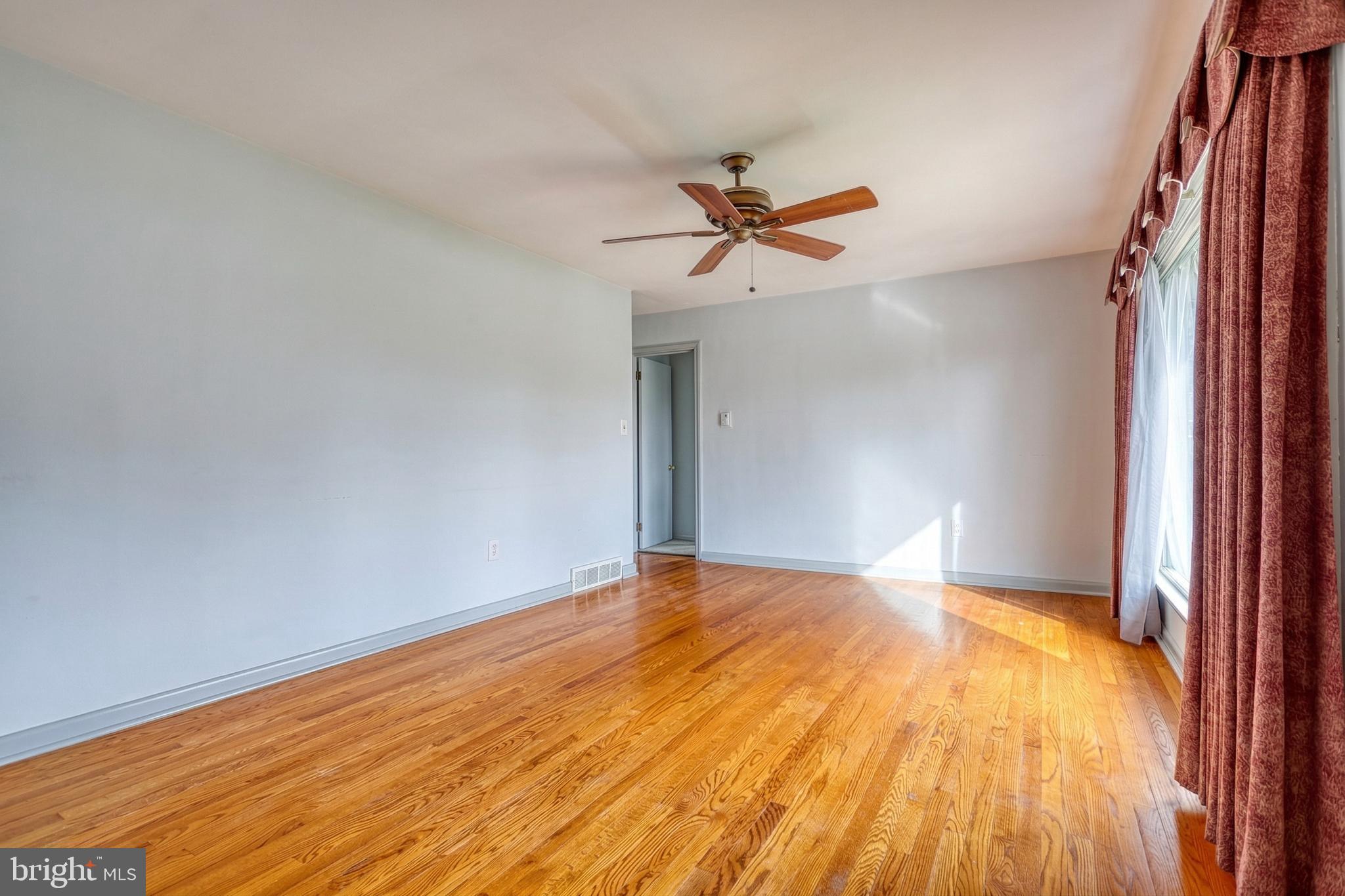 30 Lincoln Drive Hanover, PA 17331 - Photo 16 of 74 a view of a big room with wooden floor and a chandelier fan