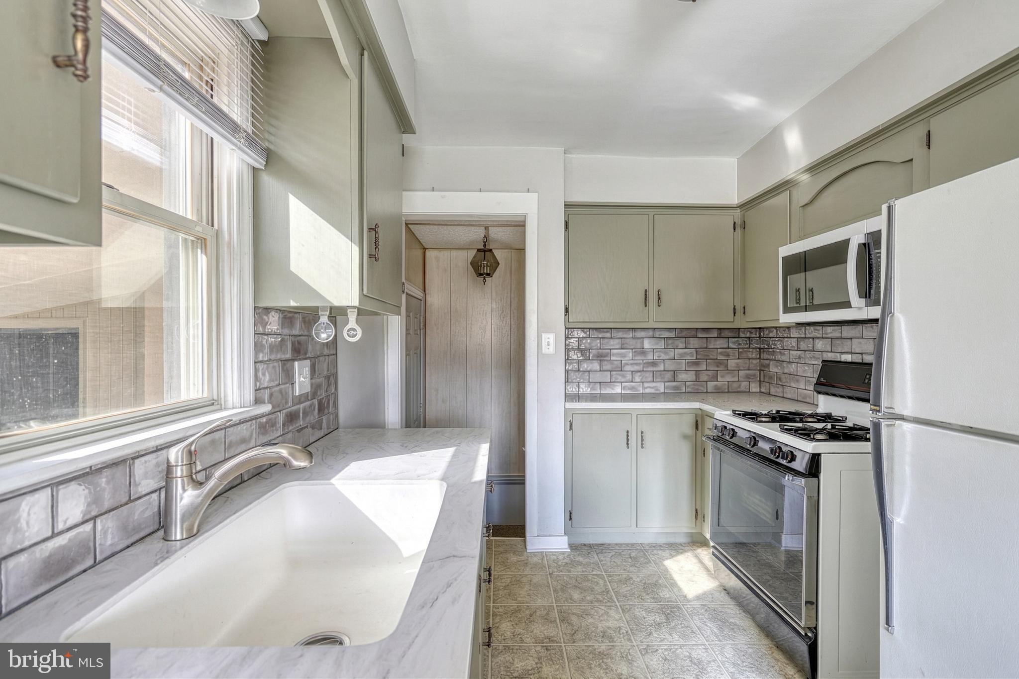 30 Lincoln Drive Hanover, PA 17331 - Photo 29 of 74 a kitchen with stainless steel appliances granite countertop a stove a sink and a refrigerator