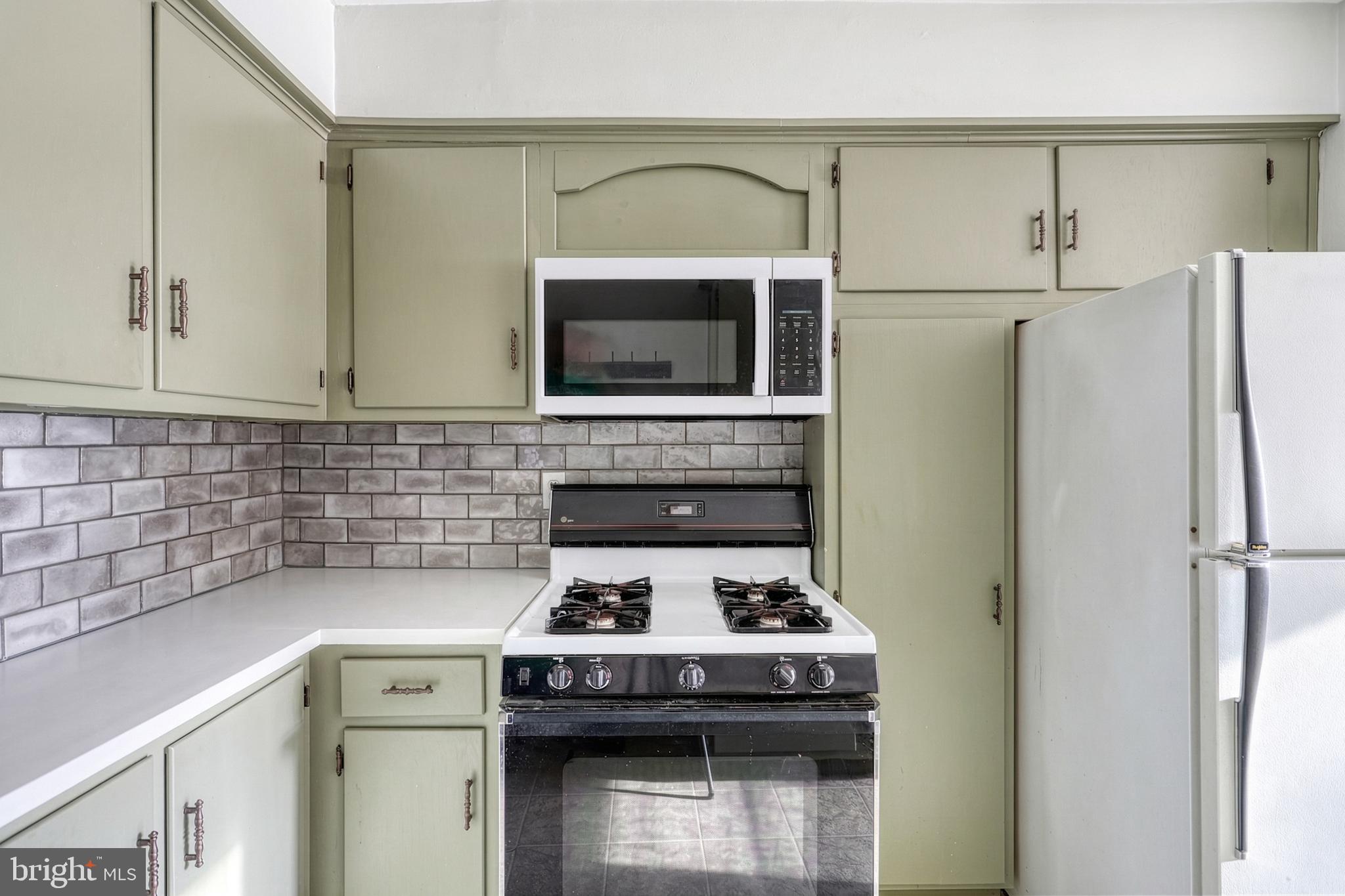 30 Lincoln Drive Hanover, PA 17331 - Photo 30 of 74 a stove top oven sitting inside of a kitchen