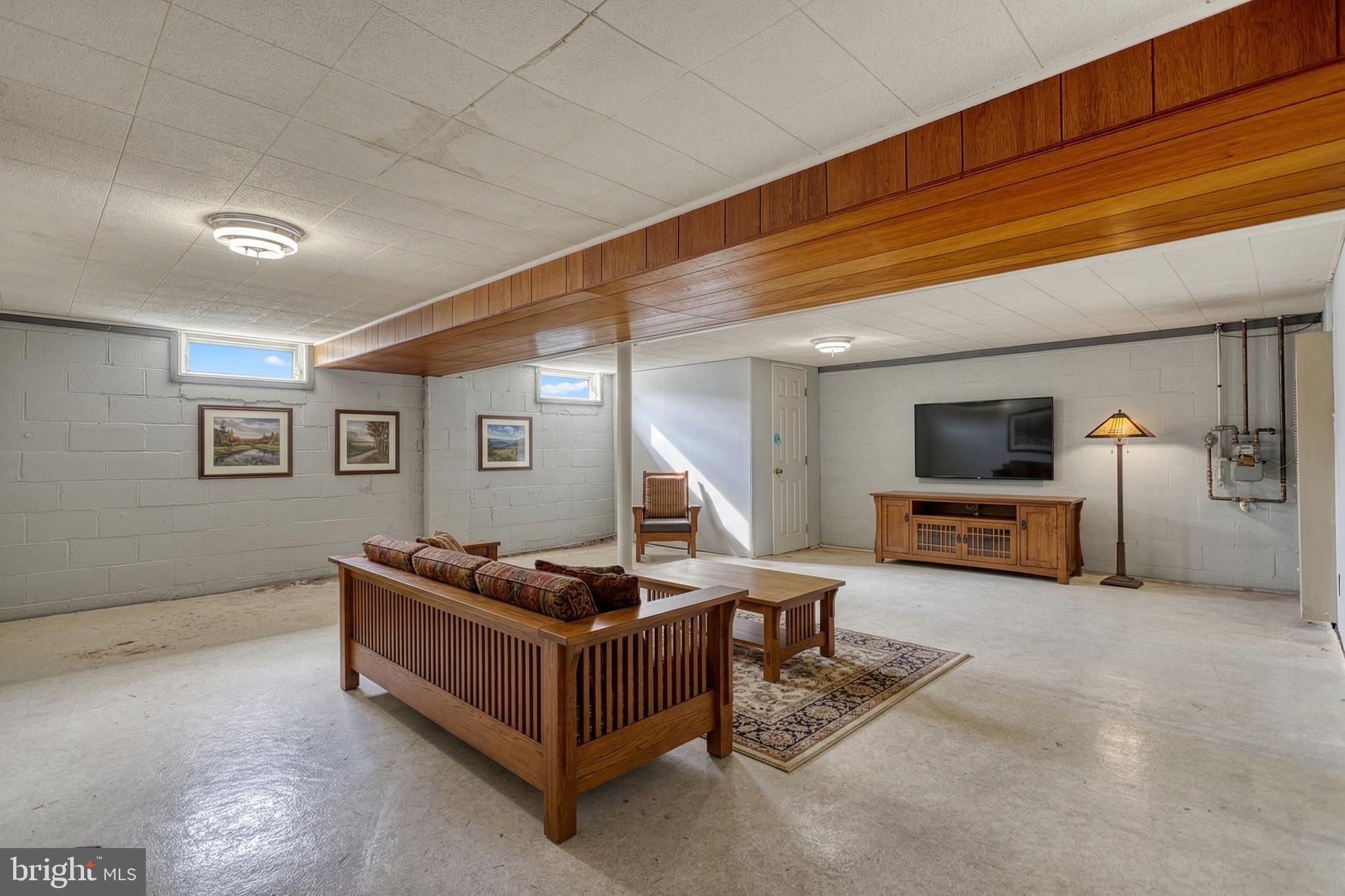 30 Lincoln Drive Hanover, PA 17331 - Photo 44 of 74 a living room with furniture and a flat screen tv
