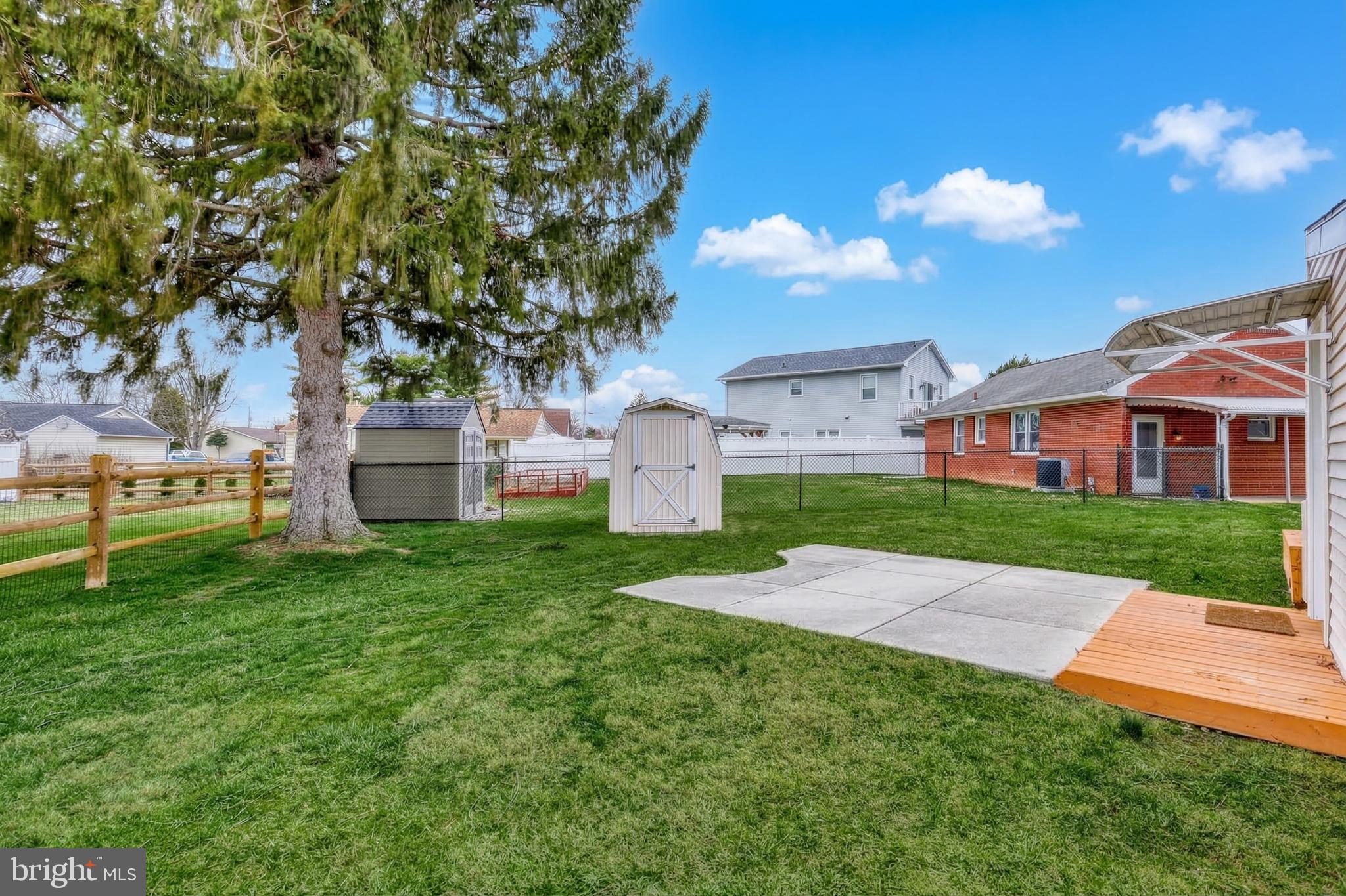 30 Lincoln Drive Hanover, PA 17331 - Photo 51 of 74 a view of a white house next to a yard with big trees