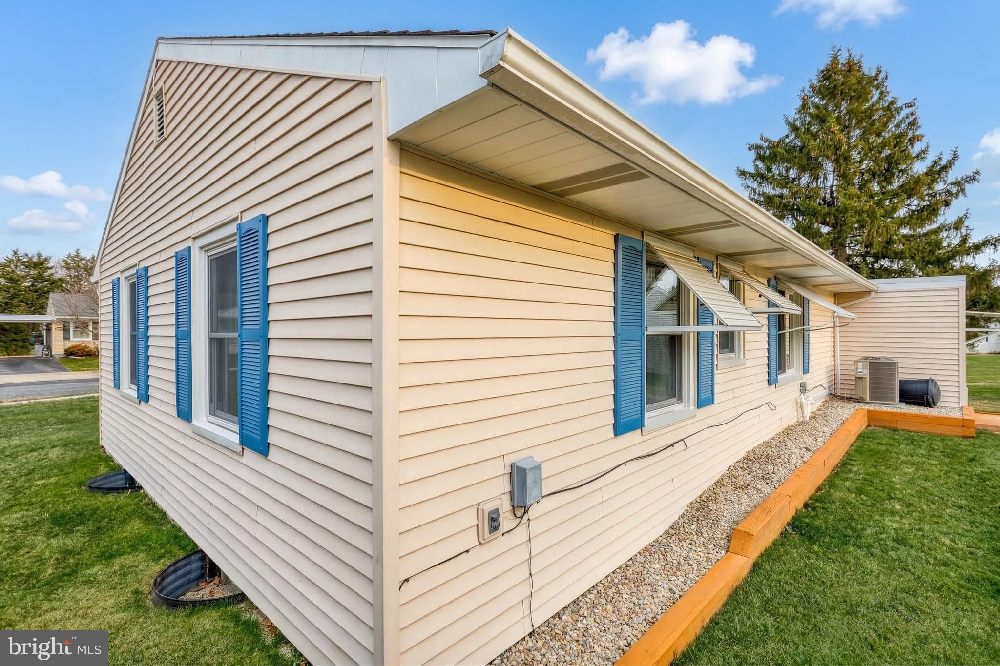 30 Lincoln Drive Hanover, PA 17331 - Photo 54 of 74 a view of a white house with a yard and potted plants