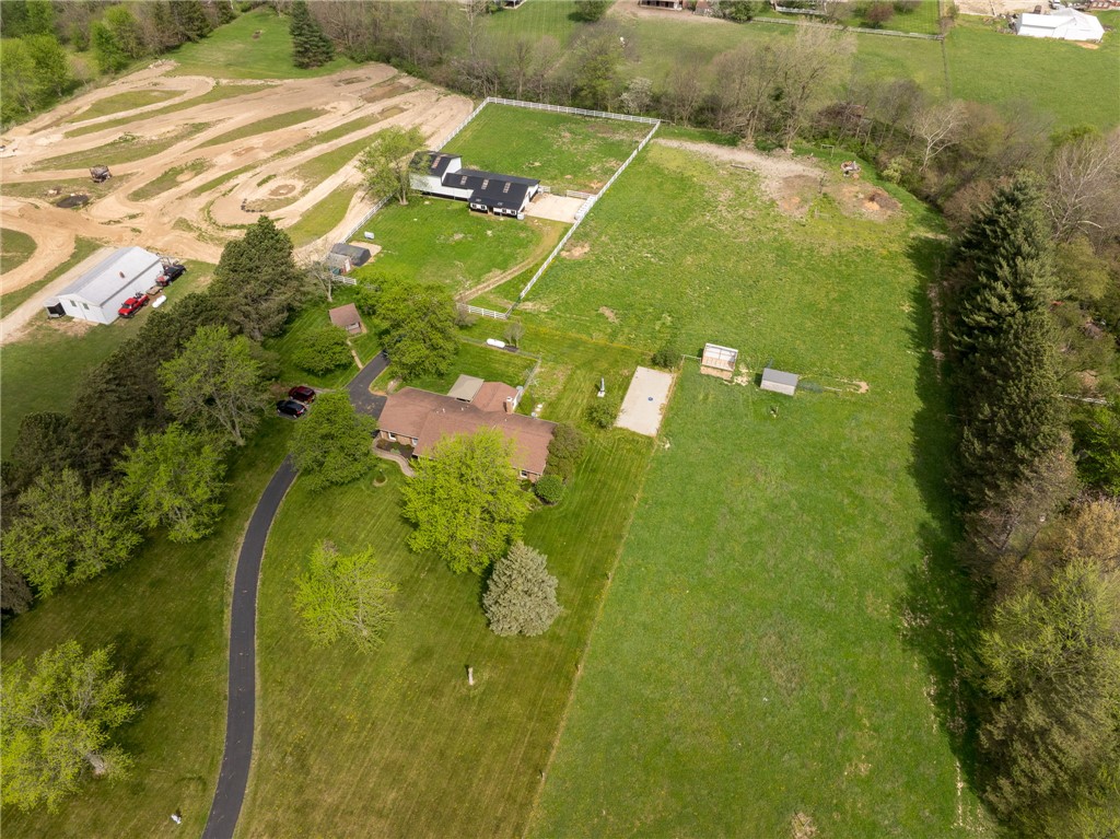 7988 McCool Road Greenville, OH 45331 - Photo 41 of 50 This expansive estate offers a sprawling lawn, mature trees, and ample space for outdoor pursuits.