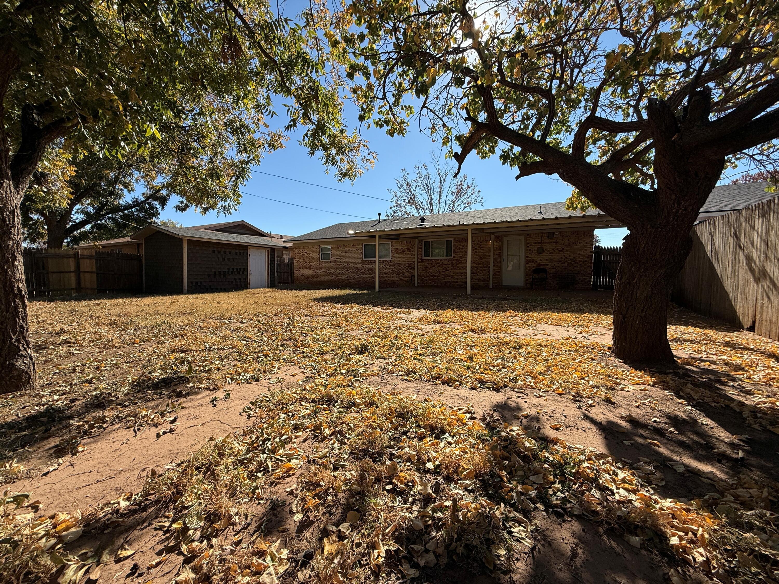 5420 42nd Street Lubbock, TX 79414 - Photo 2 of 8 a view of a backyard of the house