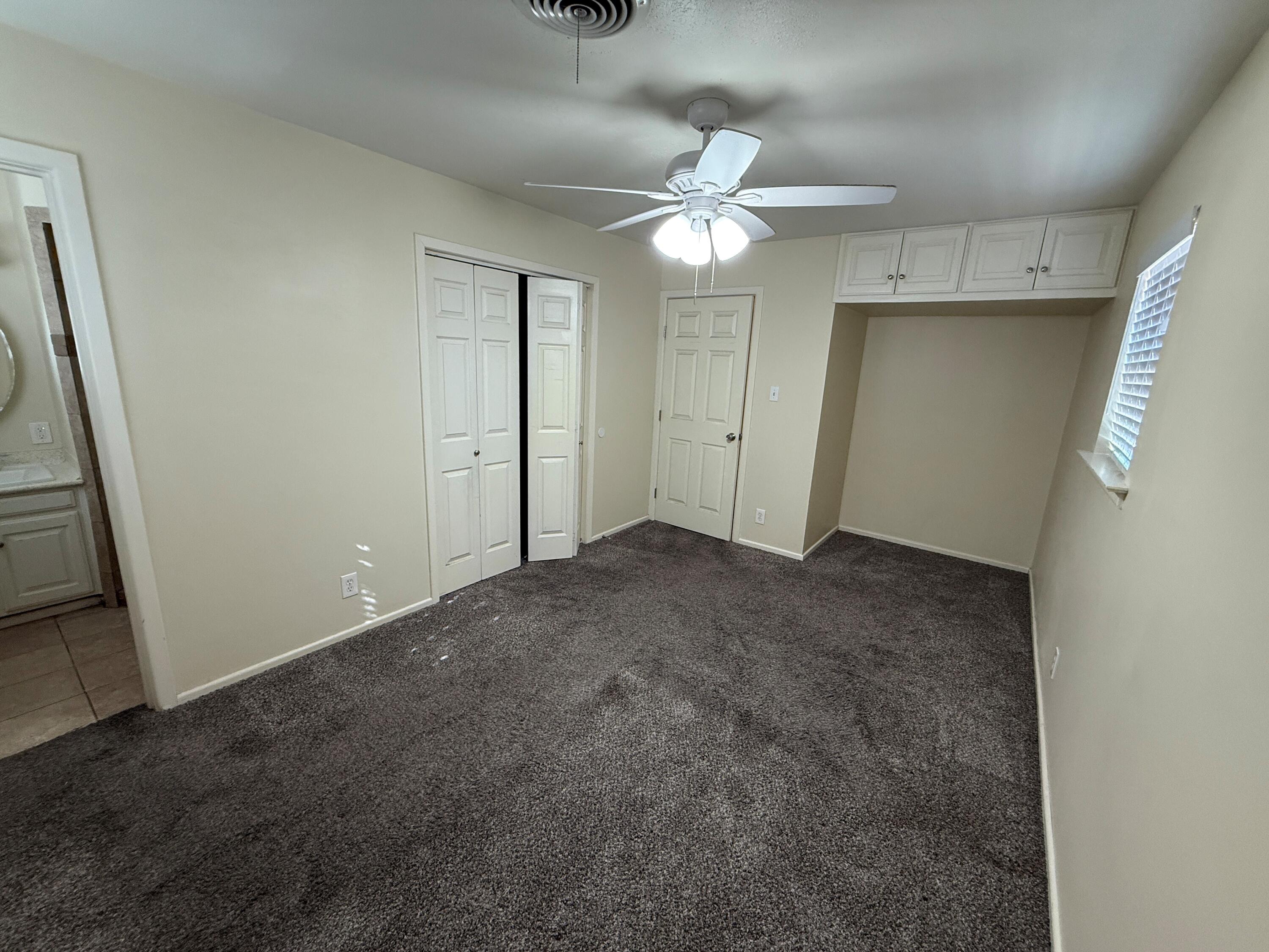 5420 42nd Street Lubbock, TX 79414 - Photo 6 of 8 an empty room with a bathroom