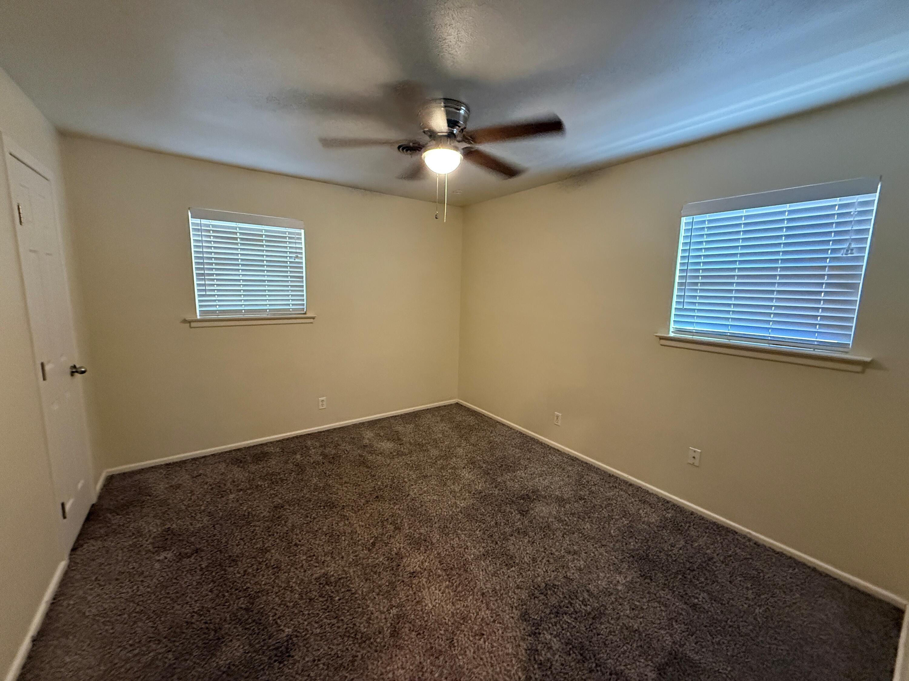 5420 42nd Street Lubbock, TX 79414 - Photo 7 of 8 a view of an empty room with a window