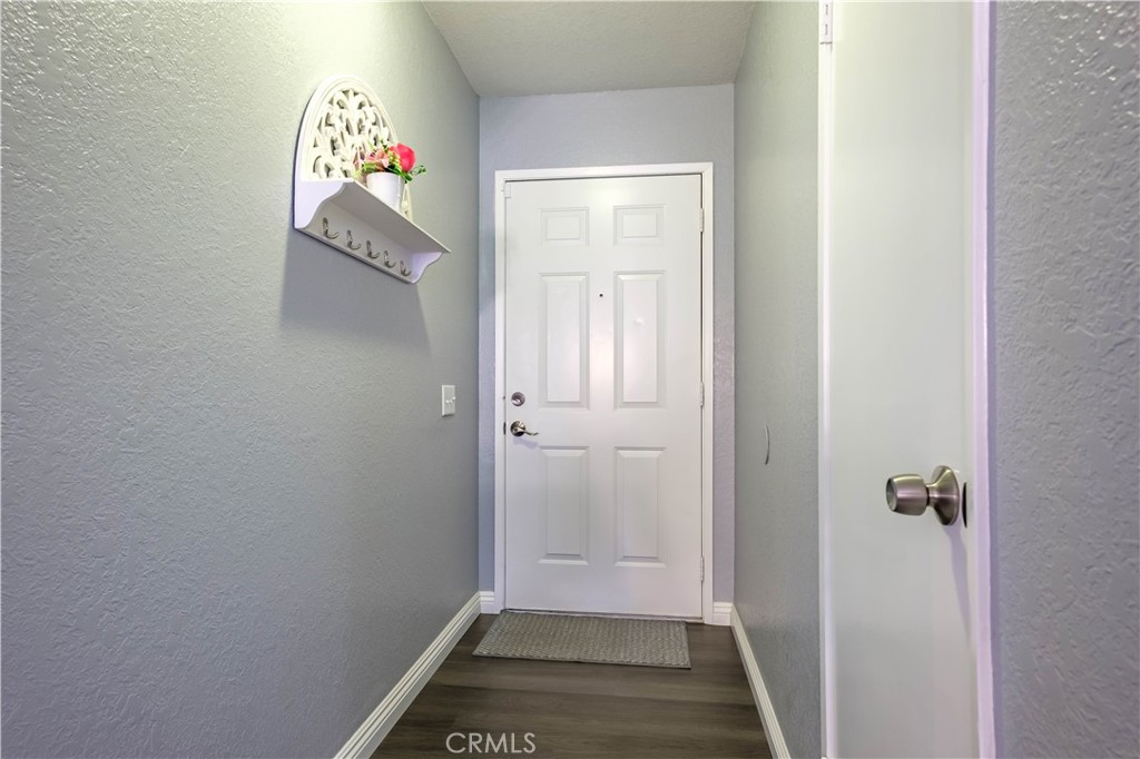 26210 Del Sol Road Apple Valley, CA 92308 - Photo 1 of 1 a view of an entryway with wooden floor