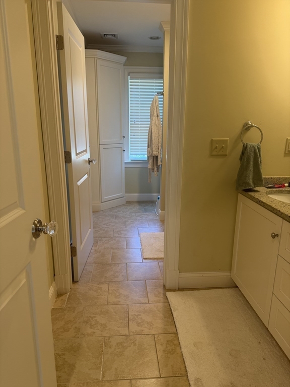 65 Denton Road Wellesley, MA 02482 - Photo 12 of 16 a bathroom with a granite countertop shower and a sink