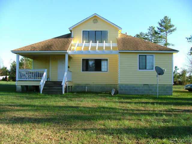 11000 White Oak Road Dewitt, VA 23840 - Photo 1 of 1 a front view of a house with a yard