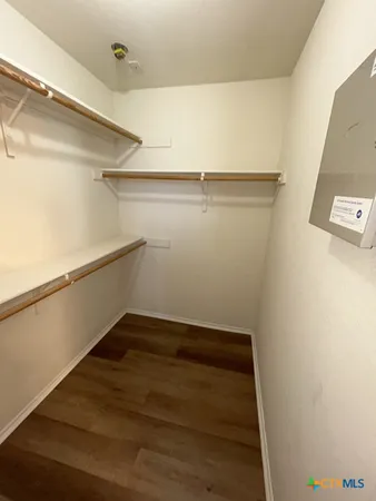 a view of an empty walk in closet