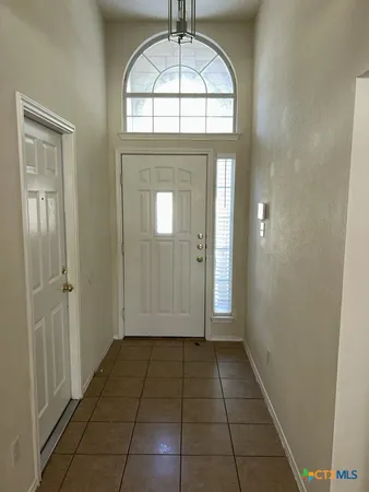 an empty room that has a window in it