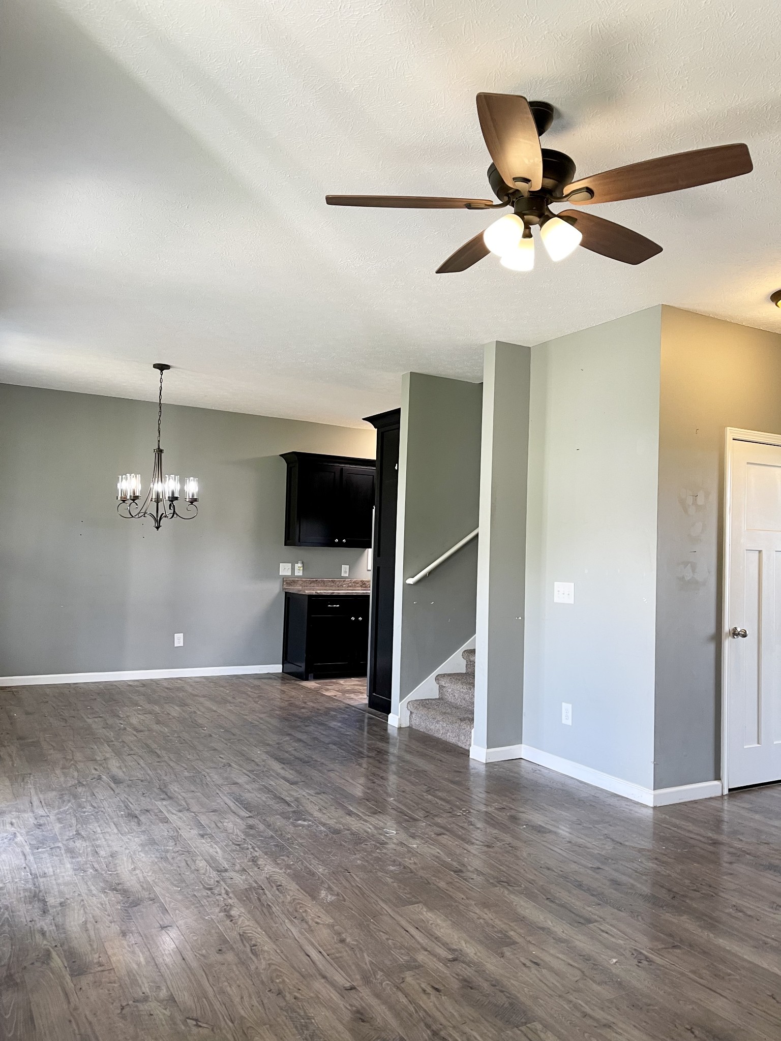 319 Riot Road Portland, TN 37148 - Photo 11 of 26 a view of a livingroom with a ceiling fan a ceiling fan and wooden floor