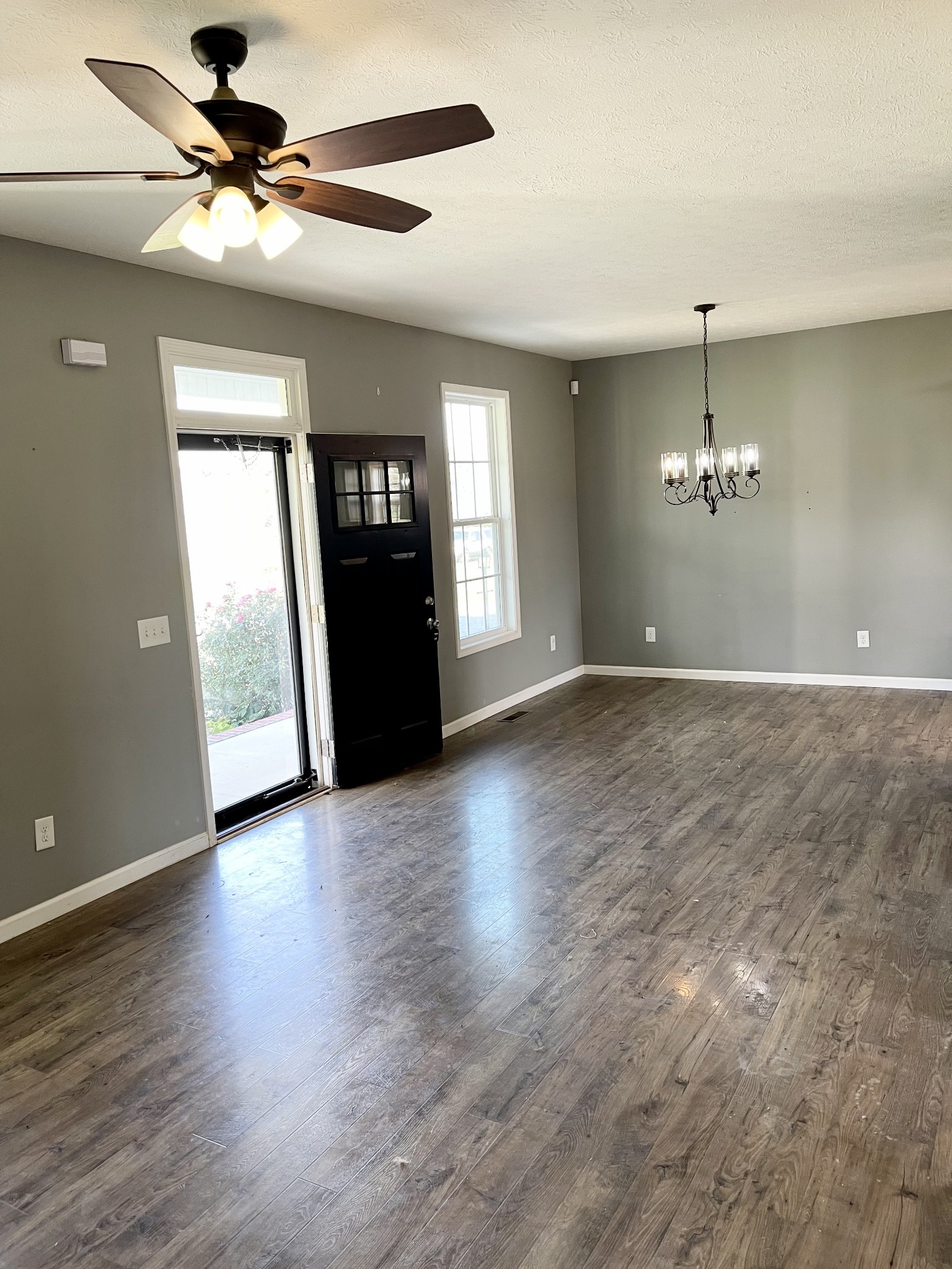 319 Riot Road Portland, TN 37148 - Photo 13 of 26 a view of a livingroom with a ceiling fan window and wooden floor