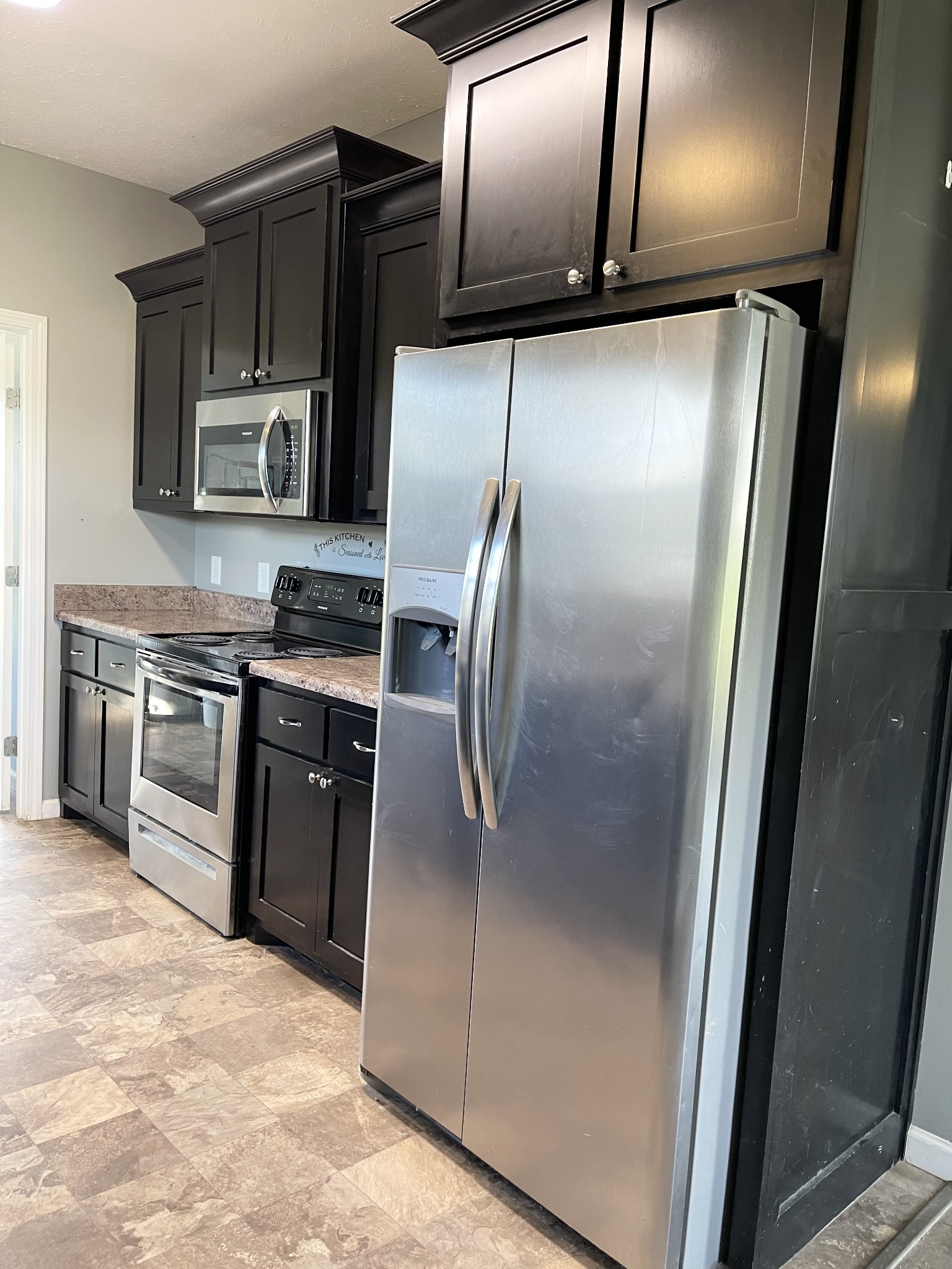319 Riot Road Portland, TN 37148 - Photo 16 of 26 a modern kitchen with stainless steel appliances granite countertop a refrigerator and a stove