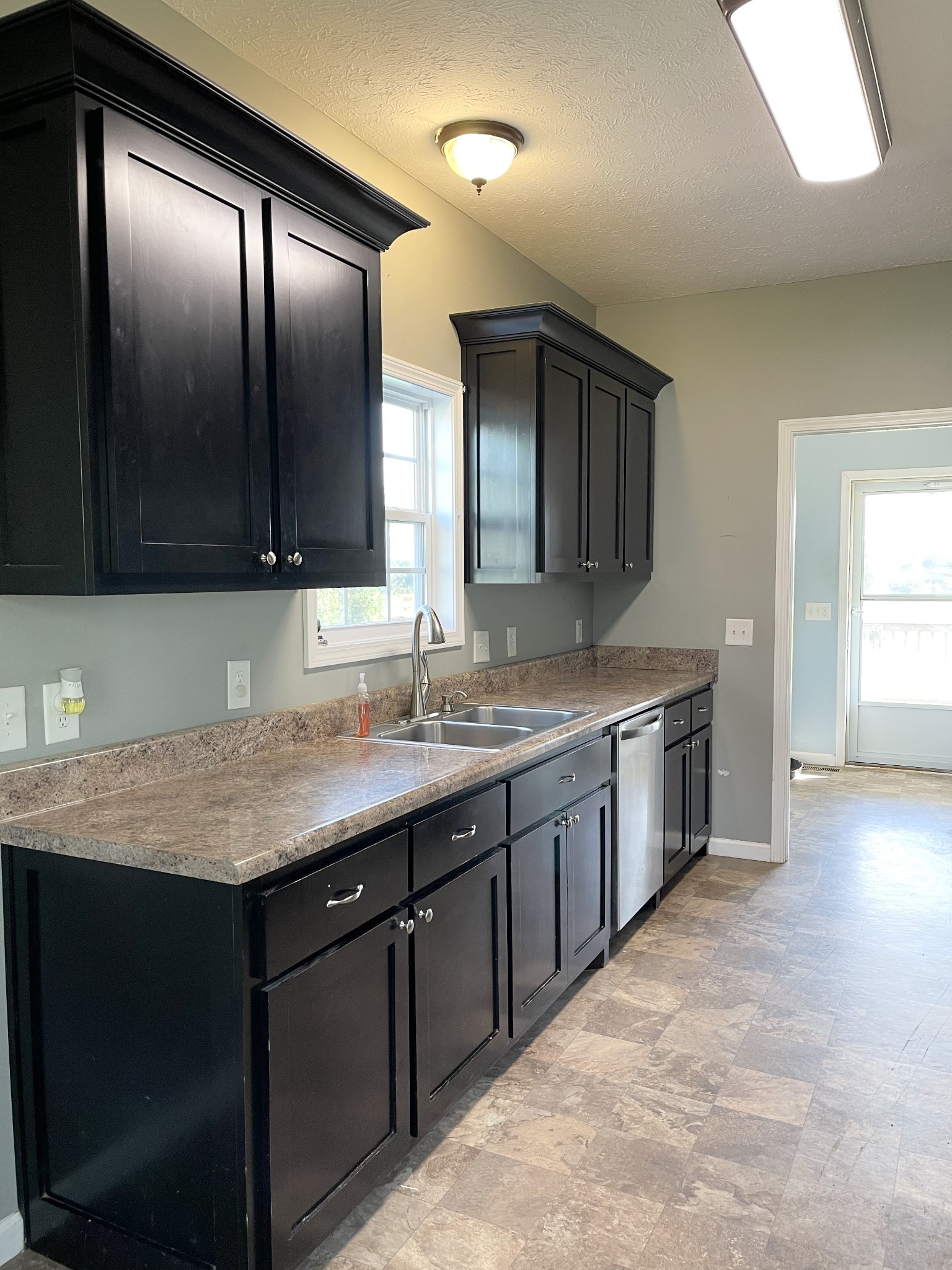 319 Riot Road Portland, TN 37148 - Photo 17 of 26 a bathroom with a granite countertop sink and a large mirror